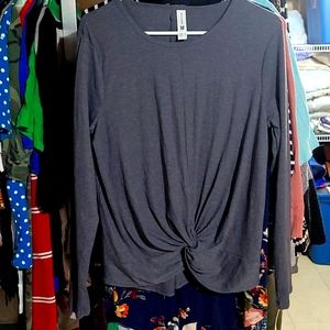 moisture wicking, twist up center shirt